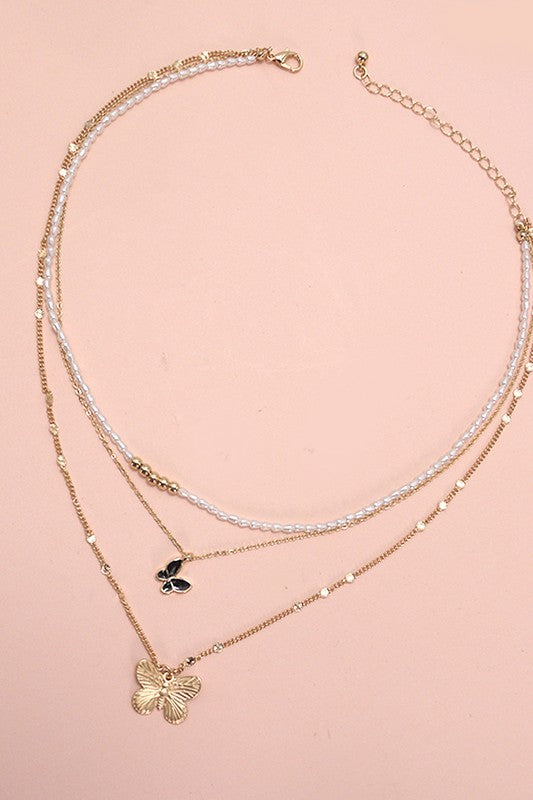 Pearl butterfly charm necklace